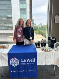 Drs. A & B standing at a table