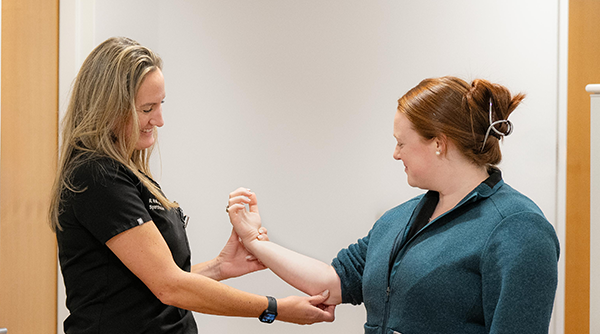 clinician holding a pt's elbow