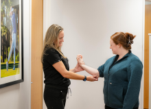 physician examining a patient's arm